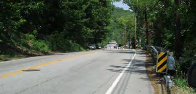Small stretches of the road have almost no shoulder and are constrained by slopes or vegetation that makes it nearly impossible to find space in which to walk safely.