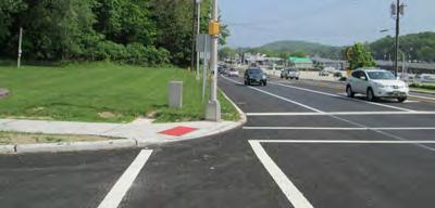 Pedestrian improvements have been completed at the intersection of Washington Avenue and Route 23, including ramps, painted crosswalks, pedestrian signals, and new sidewalks leading into the Walmart