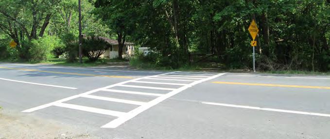 Crosswalks and Signage: Ensure every trail crossing has a painted crosswalk and warning signage. Long Term: 1.