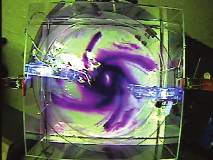 Flow at the bottom is convergent, which can be made easily visible by dropping in permanganate crystals, as seen in Figure 4d. The students can also observe the dye rising near the center (Figure 5).