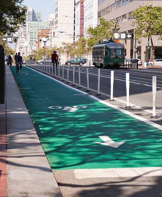 Market Street Safe hit posts and green paint added to buffered bike lane.