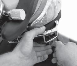 SUPERLITE-17 A/B While the diver holds the helmet down, push up on the neck clamp assembly (see above) until the clamp is
