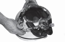 Any angle is acceptable provided that 1) the valve handle can be turned easily and 2) the diver can locate the handle easily. a) Attach supply whip from the EGS first stage to EGS helmet valve (50).