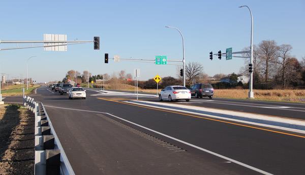 arterial and cross streets and acceleration/merge lanes for left turn movements from the cross street.