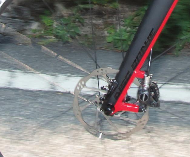 rims. Furthermore the traditional brake system could create an overheating of the carbon rims, particularly during long descents.