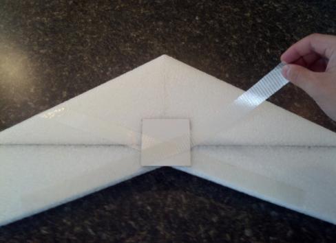 Place the Formica plates on the bottom of the wing, white side out, at the center of the trailing edge.