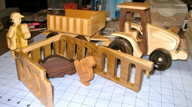 This farm tractor and trailer are crafted using maple, walnut, store-bought wheels and a scrolls saw.