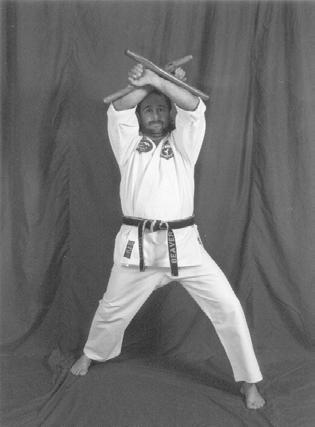 SG FROM A READY STANCE, THE TONFA SWINGS OUT IN A