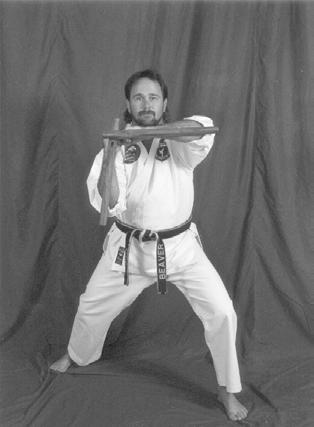 THE TONFA. THIS BLOCK CAN BE DONE HIGH OR LOW.