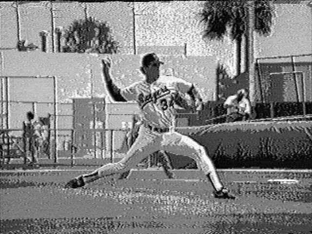 He stretches out into a stride longer than his height. This is an example an Explosive Pitcher who uses a minimal step back to get going forward.