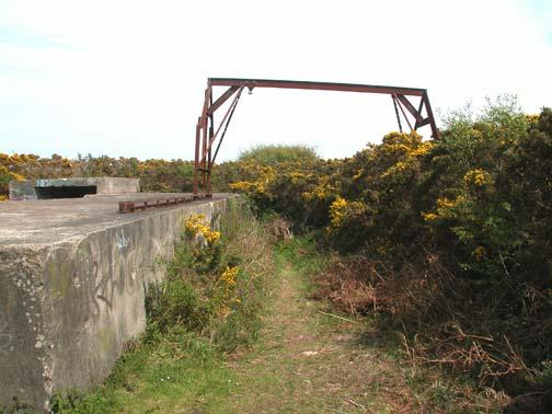 Emplacement No 1 still has the gantry which lifted the shells from the transport into the ammunition storage bunkers. The shells were then manhandled onto the gun platform.
