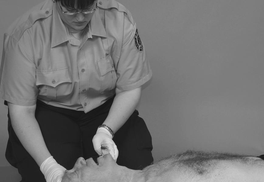 Now press down to compress the chest at least 2 inches. Apply 30 compressions at the rate of at least 100 compressions per minute. Count the compressions out loud: One and two and three and.