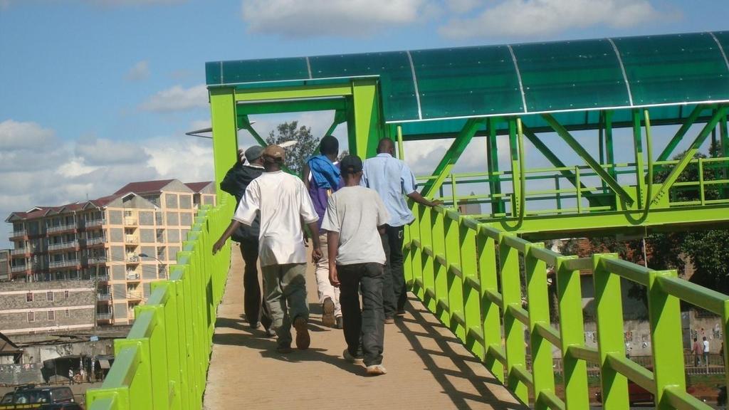 Picture 42: Pedestrians crossing Pangani Footbridge using ramp section Source: Author, 2012 Picture 43: Muthaiga Pedestrian Footbridge showing staircase approach Source: Author, 2012 4.7.