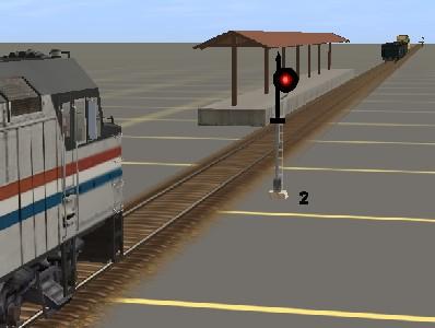 In the picture above, the passenger train is stopped at the signal.