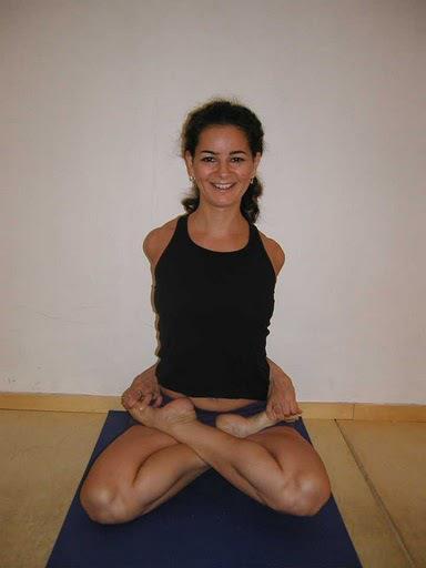 25) Bound Lotus Posture (Baddha Padmasana) Benefits Stretches the arms and front of the chest Stretches the hips and knees Helps improve sitting posture Start sitting with your legs out in front of
