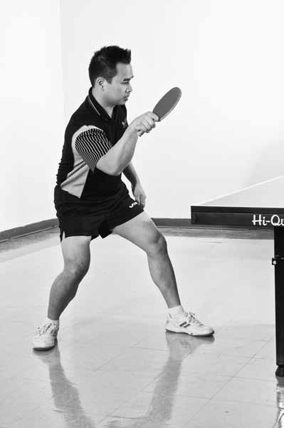 Table Tennis: Steps to Success a b Figure 3.23 One-step movement to the left: (a) ready position; (b) move left foot to the ball.
