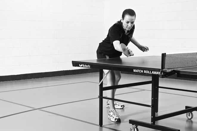 Table Tennis: Steps to Success a b Figure 4.6 Recovery after a short forehand push: (a) the body is over the table and the right foot is under the table; (b) jump back to ready position.