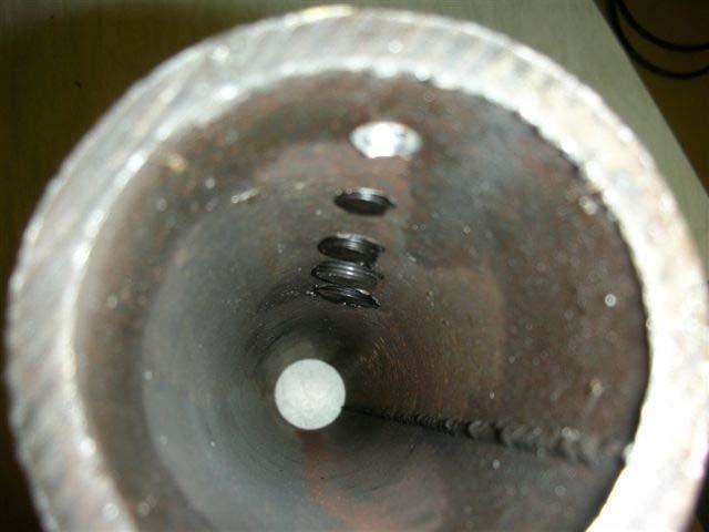 tightening malleable plug into coupling. Check for leaks.