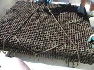 The mesh bags may also be placed on racks constructed of steel reinforcing bar (rebar).