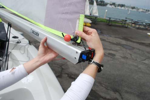12. Attach the outhaul of the sail (located on the port side of the boom)
