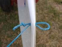 Fit the spinnaker pole to the front beam using the pin and retainer clip.