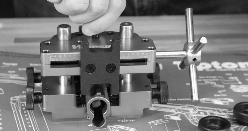 5. Adjust the height of the Top Carriage Assembly above the pistol slide by turning the