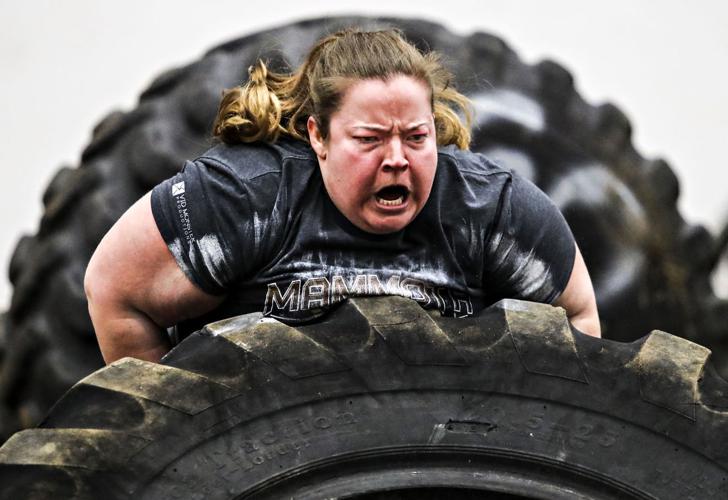 In trials that contestants said put their mental and physical strength to the test, several dozen muscular men and women flipped monster truck tires, pulled trucks and lifted and walked with a range