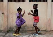About this photo In this photo, Fatu and her sister Kumba are playing a jumping game called Akra.
