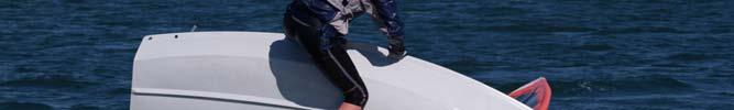 When you have a firm grip on the centreboard, pull yourself onto the hull, and kneel or stand as close to the edge as