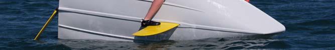 Keeping hold of the centreboard, lean back and the boat will slowly return to floating on its side.
