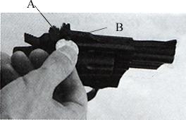 If your shots hit high, turn the adjusting screw in front of the rear sight