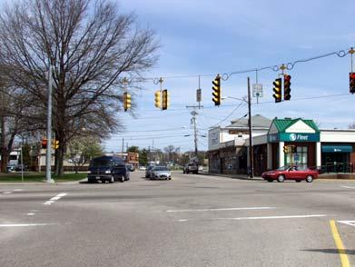 Mansfield Recommendation: Move the bike-route right-turn sign on High Street to the end of the block, at the intersection with Rumford Avenue.