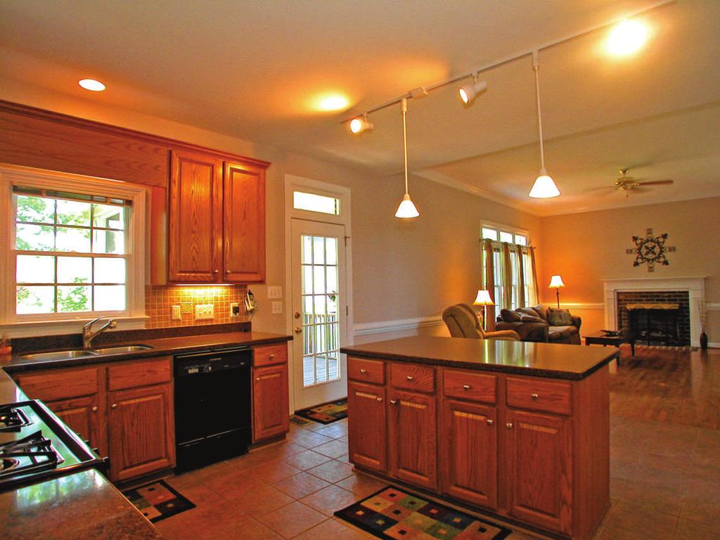 center island with breakfast bar Generous counter & storage space Pendant + track light