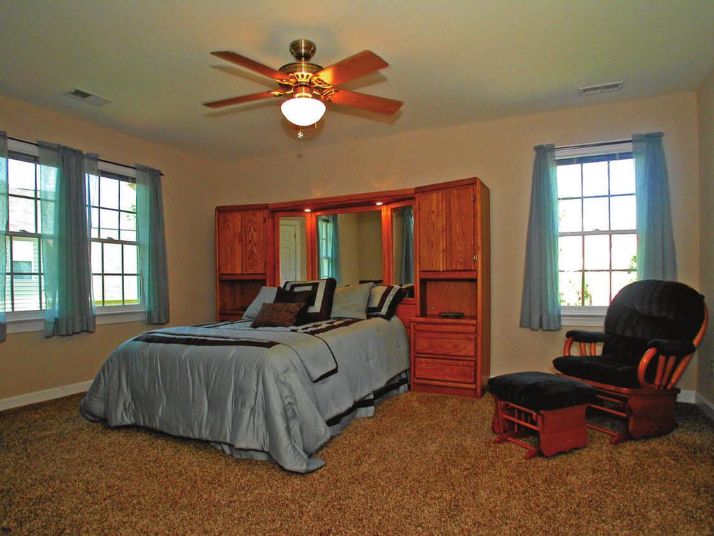 Two, secondary bedrooms on the upper floor share a large hall bath.