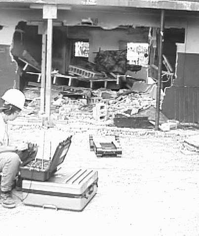 b. a. Fig. 1. a.) Testing a mobile robot at the SRDR USAR test site, and b.) a typical void formed by rubble falling against furniture. that is un-enterable by humans.