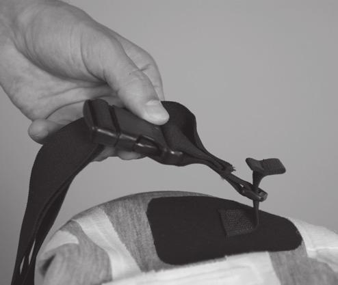 Figure 5 4. Once the nylon strap has been threaded, flare the sewn folds on the strap to prevent it from passing back through the rectangular clip. 5. repeat these steps for the other attachment point.