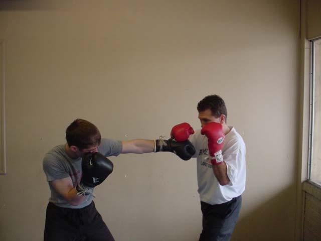 Here I block the left jab by pushing or