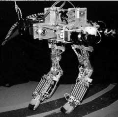 13 THE INTERNATIONAL JOURNAL OF ROBOTICS RESEARCH / February 21 Fig. 1. Photo of Spring Turkey. There are four actuators attached to the body. Power is transmitted to the hips and knees via cables.