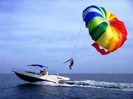 PARASAILING Take to the sky from our fully-equipped parasailing boat Feel.