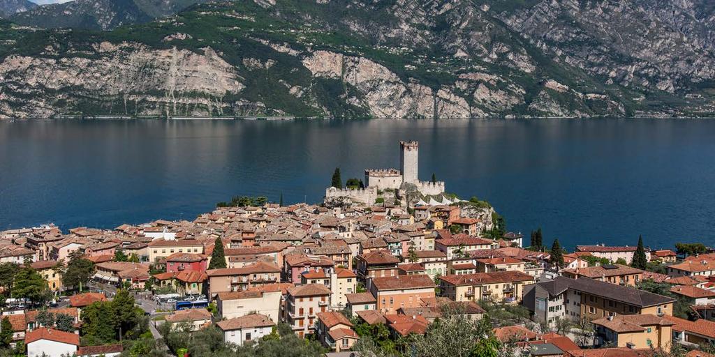 MALCESINE - NORTH LAKE GARDA - ITALY Guarded since the 14th Century by the stone towers of a Scaligeri Castle, this enchanting town combines its ancient charms with a wealth of wonderfully scenic