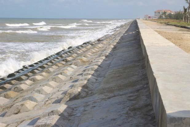 F.1.5Impermeableconcreterevetment The750mlongimpermeableconcreterevetmentcanbefoundatlocation5,wheretheroadisvery closetothesea.thestructureispaidbygovernmentalinvestment.