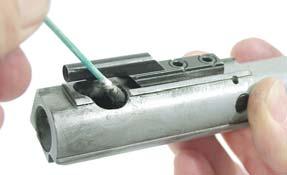 Use small end of GP brush in cam pin hole and doubledover pipe cleaner in firing pin recess.