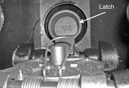 13. Push the latch back (toward the diaphragm). CAUTION DO NOT use solvents or abrasives on or near the valve body seat ring.