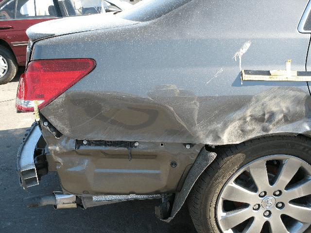 Vehicle Damage Exterior Damage - 2005 Toyota Avalon Damage Description: There were three separate front end impacts to the case vehicle.