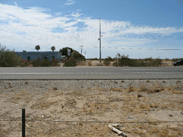 The intersecting frontage road was comprised of three asphalt travel lanes. There are two eastbound lanes and one westbound lane.