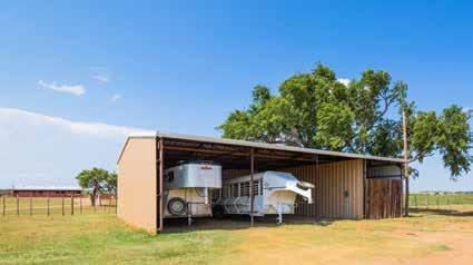 The trailer barn is all steel construction with metal siding and roof. Dimensions are 48 ft x 36 ft and it is open to the South with 11.5 ft high walls.