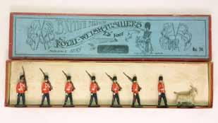 Wonderful 1st version set of pipers on round base. Circa 1896. 7 Pieces. Condition: Excellent. Estimate $1200-1800 Lot 2042 Britains Set #74 Royal Welsh Fusiliers In original slotted edge box.