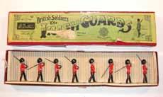 Estimate $100-200 Lot 2183 Britains: Set #107 Irish Guards 7 Guards marching at the slope, 1 officer, blue flashes on