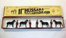tunics, tin swords, office on rearing horse with sword in original Whisstock box (NM, box VG) [5].