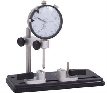 The indicator tower is designed to permit vertical and side-to-side adjustment of the dial indicator.